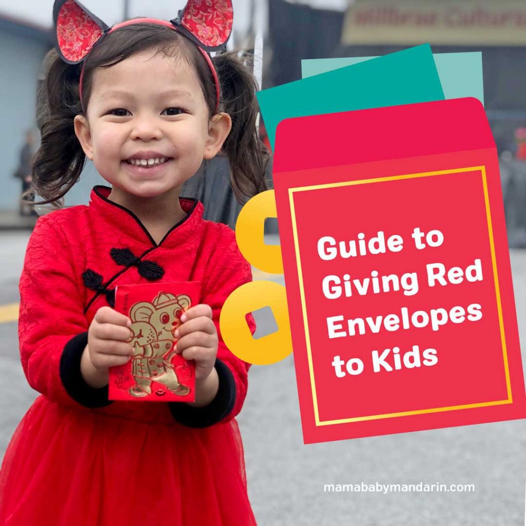 Young girl in traditional chinese dress holding a red envelope